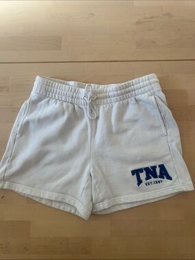 Aritiza TNA white  medium sweatfleece cozy boyfriend fit shorts with TNA logo